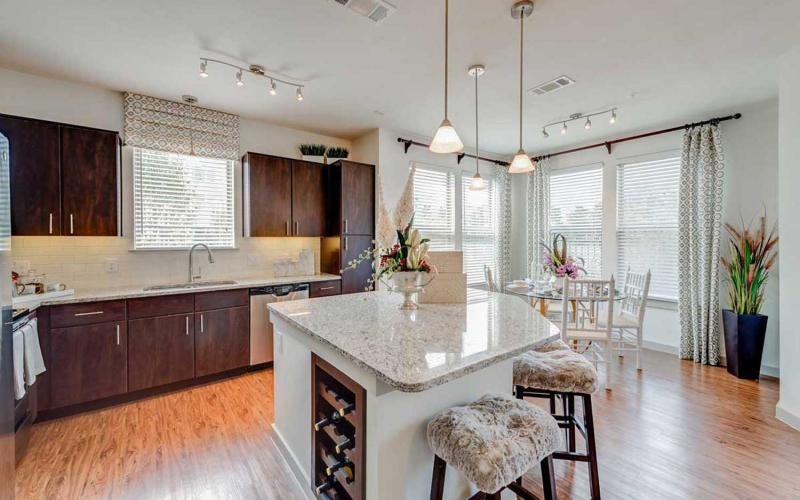 a kitchen with a marble island